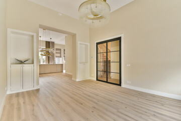 A spacious and elegantly designed modern interior featuring warm tones, stylish lighting, and a contemporary aesthetic, perfect for various uses.