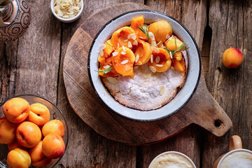Dutch pancake with apricot and almond petals. Top view.