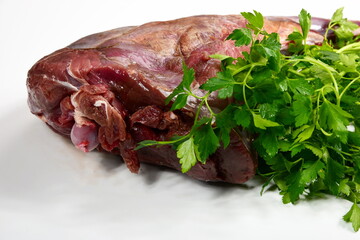 Raw hind quarter of deer leg isolated on white. Raw deer leg without skin