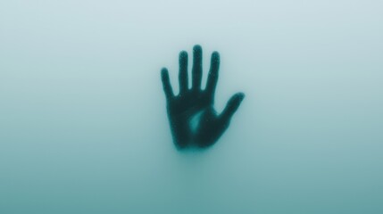 A shadowy handprint emerges from a misty background, evoking feelings of mystery and introspection.