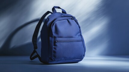 Blue backpack on a blue background.