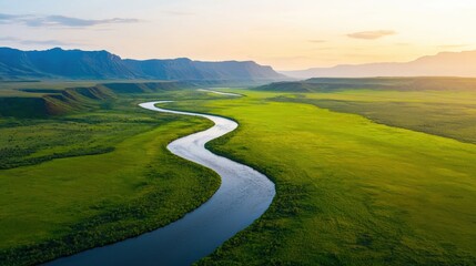 A picturesque river meanders through lush green valleys under a serene sky, surrounded by distant mountains and bathed in soft sunlight.