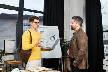 New employee engages with mentor during onboarding in a modern office setting
