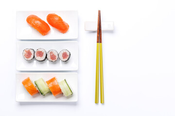 Assorted sushi and maki rolls beautifully arranged on plates