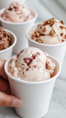 Serving ice cream in small cups with inscriptions. 