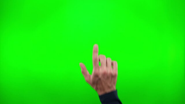 Male hand touching, pressing on green background with chromakey. Using smartphone, tablet or touch screen. Interface concept