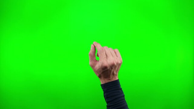 Closeup of a hand gesturing as it enters the field, zooms in as it spreads its fingers, and exits the frame against a green screen