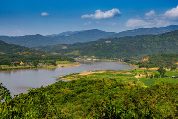 Aerial view of the high mountains and the Mekong River, is nestled in the high mountains and tropical rainforest.