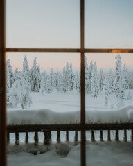 Lapland in the snow, landscapes of pristine snow topped trees and magical golden light in the artic circle. High res photography 