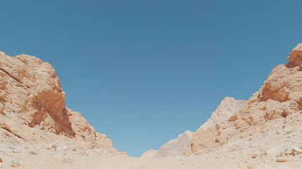 Fototapeta premium Desert canyon landscape, clear sky, rocky terrain, travel background