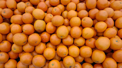 stack of orange tangerine in display rack in the market background tangerine