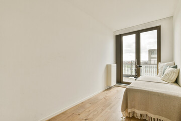 A serene interior showcasing a minimalist aesthetic with soft natural light streaming through large windows, creating a calm atmosphere.