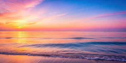Obraz premium Soft pink and orange hues illuminate a serene ocean scene at dawn, peaceful morning
