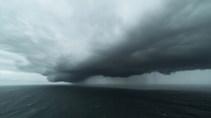 Fototapeta premium A powerful cyclone forming over the ocean, with dark clouds swirling above,