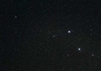 Obraz premium Deep blue night sky filled with glowing stars creating a cosmic celestial background.