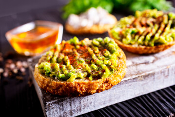 Fresh sandwich with avocado and herbs and seeds