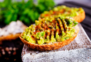 Fresh sandwich with avocado and herbs and seeds