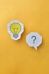 A glowing light bulb and a question mark next to it. The problem and its creative solution