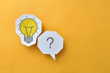 A glowing light bulb and a question mark next to it. The problem and its creative solution