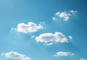 Fototapeta premium Tranquil Sky with Scattered Fluffy Clouds Against a Brilliant Blue Background