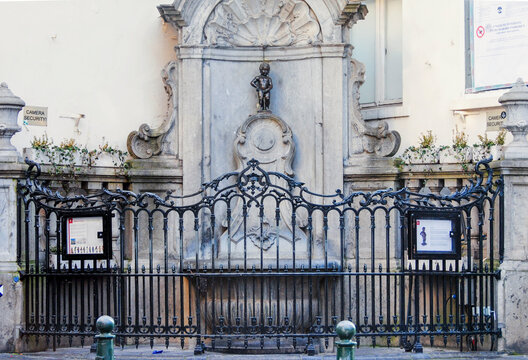 Manneken Pis bronze sculpture. Manneken Pis is a landmark small bronze sculpture in Brussels, depicting a naked little boy urinating into a fountain's basin.