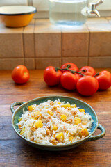 Black radish salad with baked potato, walnuts and olive oil on a kitchen table. 