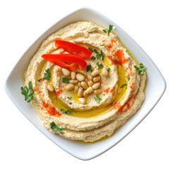 Classic hummus garnished with olive oil, pine nuts, paprika, parsleClassic Hummus with Olive Oil, Pine Nuts, and Paprika