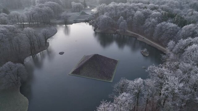 Drone footage of Cottbus pyramid in branitz park with winter landscape