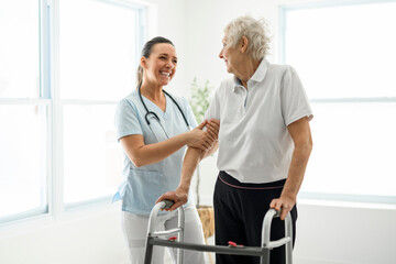 Fototapeta premium portrait of a young nurse doctor with a senior patient and love during a consultation