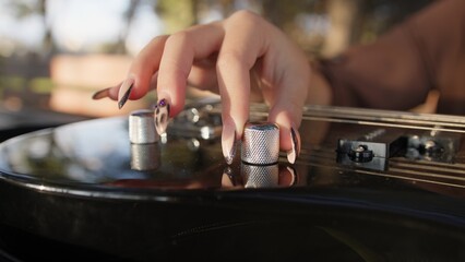Woman Hands Turn Knobs For Tone Of Electric Bass Musical Instrument