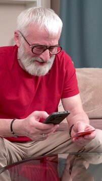 Man entering card details on mobile phone