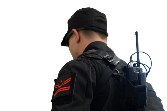 Rear view of a soldier with radio on his back isolated on white