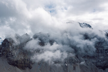 Fototapeta premium A rocky peak shrouded in clouds.