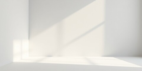 Obraz premium Serene Minimalist Room Corner with Sunlight Streaming Through Window, Creating Subtle Light and Shadow Patterns on Pristine White Walls and Floor