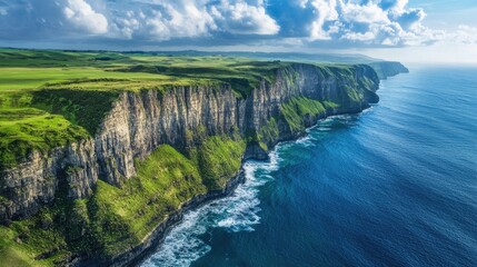 A dramatic view of the New Zealand coastline from above, showcasing towering cliffs, deep blue seas, and abundant greenery.
