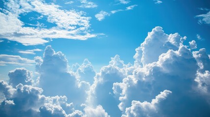 A sleek airplane glides gracefully through fluffy white clouds against a bright blue sky backdrop.