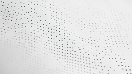 A series of tiny dots create an intricate pattern on a smooth surface, casting gentle shadows while inviting viewers to explore the nuances of light and texture in minimalist art