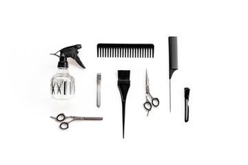 Barbershop tools set on white background - combs and scissors, top view