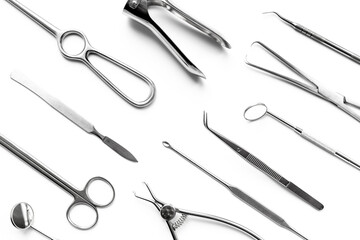Surgical professional stainless metal instruments on white background, top view. Medical equipment