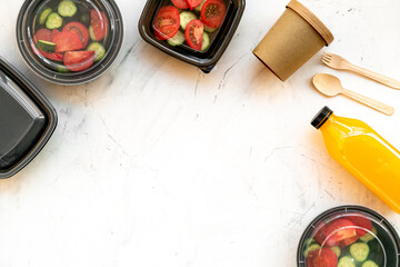 Tomatoes salad in plastic delivery tray, top view. Catering concept