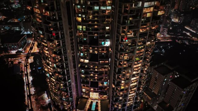 Aerial view of Mumbai city at night, showcasing the vibrant cityscape and skyline of Central Mumbai, including Lalbaug-Parel, Lower Parel, Worli, and Curry Road, with illuminated residential apartment