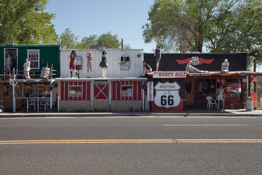 Williams, Arizona, USA: May 2014: Street scene with classic car in front of souvenir shops in Williams, one of the cities on the famous route 66