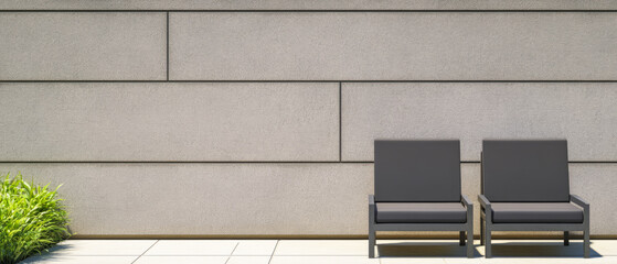 Modern outdoor seating area beside a light gray textured wall with a touch of greenery