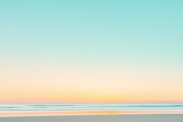 Fototapeta premium glowing horizon with golden hues blending into soft blue sky during serene beach sunrise
