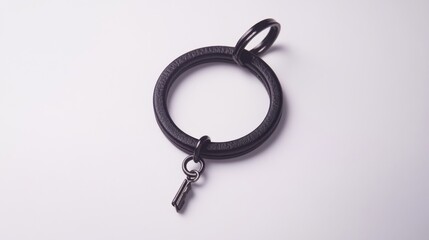 Simple black keychain with a sturdy ring and a small pendant, white background