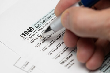 1040 form. and W2 Internal Revenue Service tax forms. Selective focus.