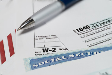 1040 form. and W2 Internal Revenue Service tax forms. Selective focus.