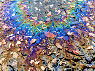 Oil Petrol Pollution Metallic  Rainbow Gasoline Leak on Pavement