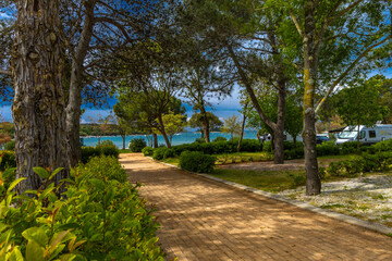 Fototapeta premium Wild beaches without people, a moment before the storm and storm on the Adriatic Sea, around Rovinj, Istrian heavy sky with clouds, rough waves, wild nature
