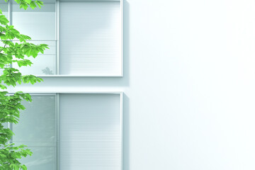 Fresh and modern building facade with green foliage and light colored walls, creating serene atmosphere. design emphasizes simplicity and tranquility